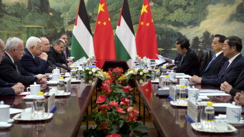 Palestinian President Mahmoud Abbas (2nd L) listens as Chinese Premier Li Keqiang (2nd R) speaks during a meeting at the Great Hall of the People in Beijing on July 19, 2017
