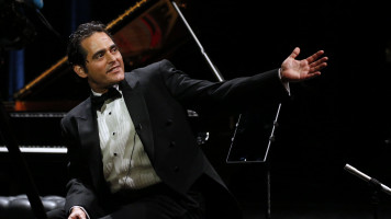 Syrian-American pianist and composer, Malek Jandali gestures on stage