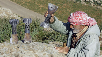 Lebanese farmer Israeli shells (AFP)