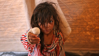 Displaced syrian girl in Idlib - AFP