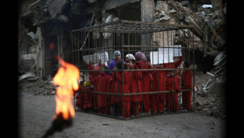 Douma caged protest- Ben Jacobs