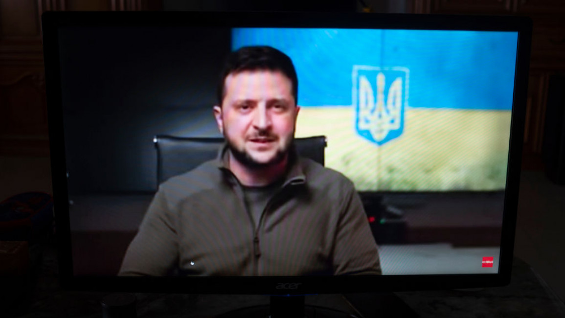 Ukraine's President Volodymyr Zelensky on a screen