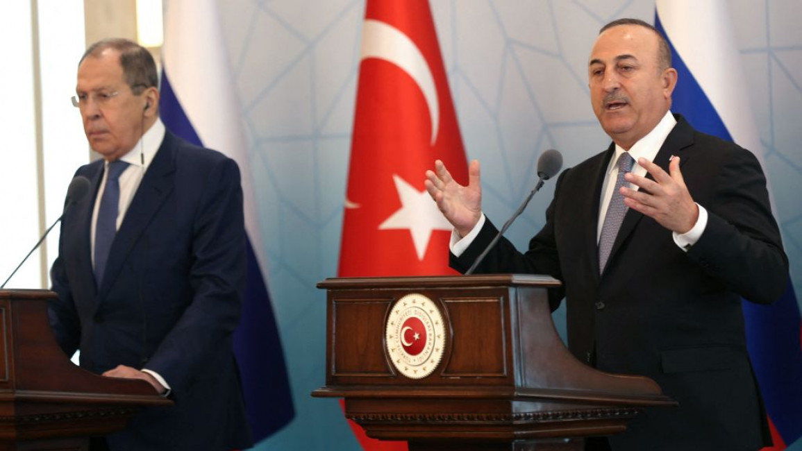 Russia's Foreign Minister Sergei Lavrov (left) stands next to his Turkish counterpart, Mevlut Cavusoglu (right).