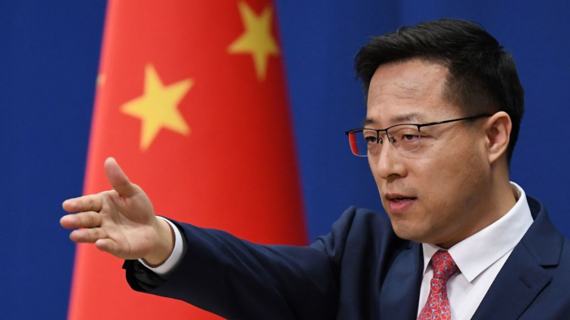 Zhao Lijan, Chinese foreign ministry spokesperson, points his hand out at a press briefing