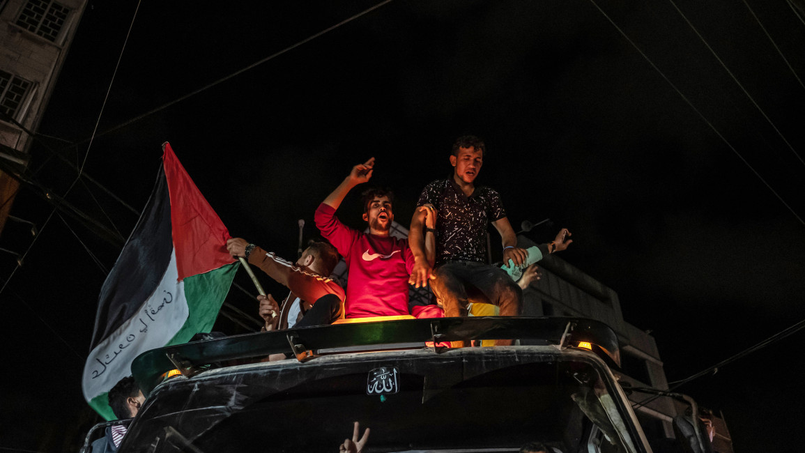 Palestinians celebrate the cease-fire agreement between Israel and Hamas on May 21, 2021 in Gaza City, Gaza [Getty]
