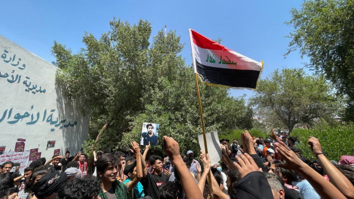An Iraqi flag held up during a protest