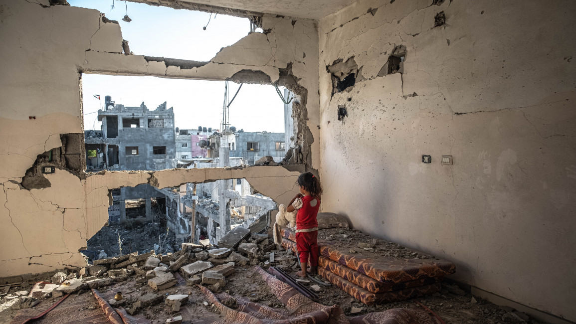 A Palestinian girl stands amid the rubble of her destroyed home on 24 May 2021 in Beit Hanoun, Gaza. [Getty]