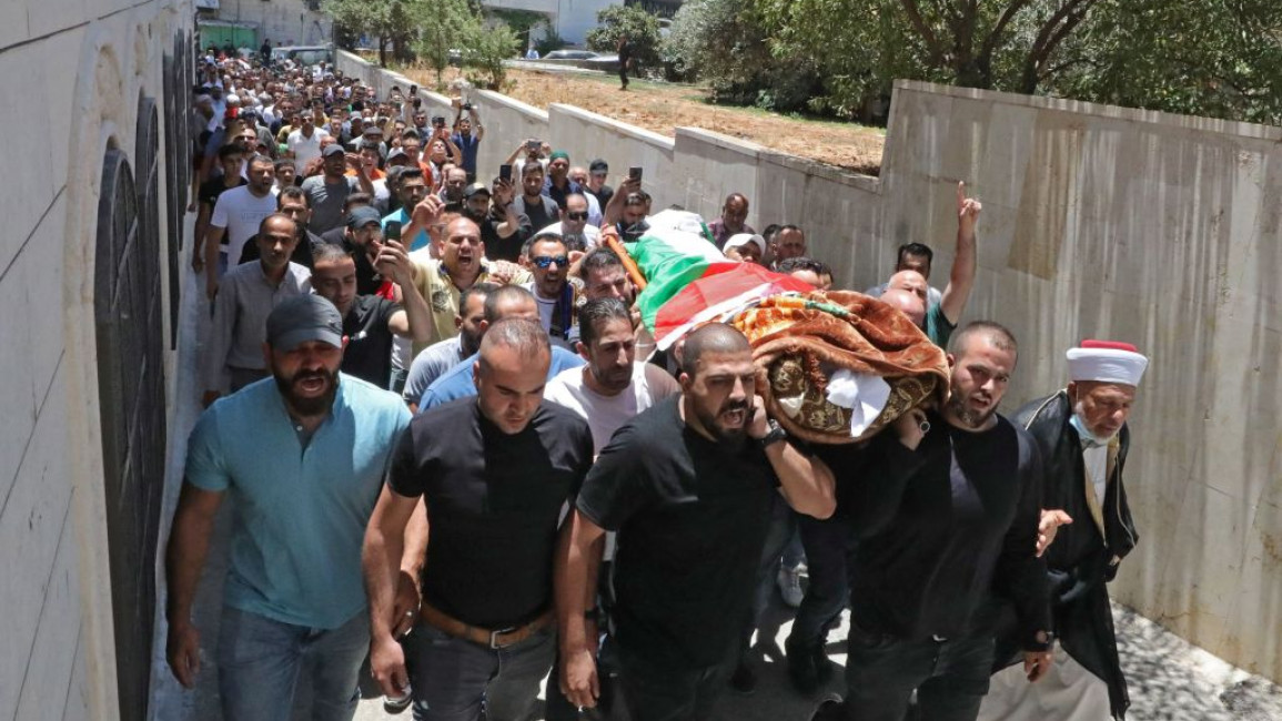 Palestinians attend funeral for PA critic Nizar Banat in Hebron