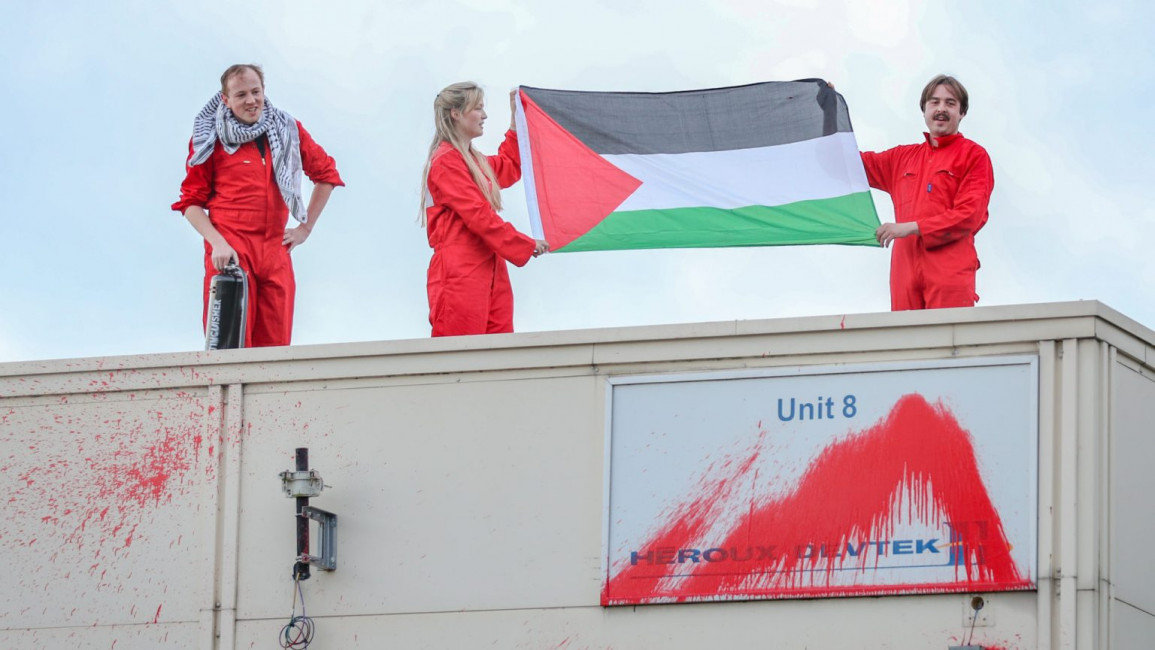 Palestine Action activists on the roof of the factory