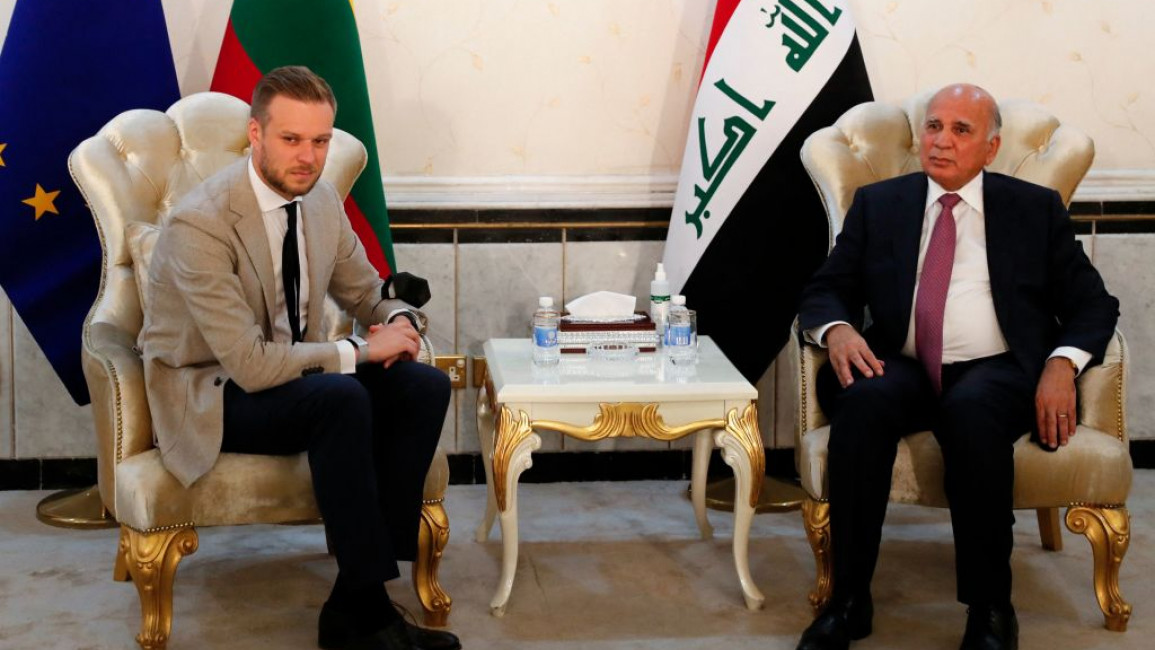Fuad Hussein (right) and Gabrielius Landsbergis met in Baghdad to discuss migrant smuggling [Getty]