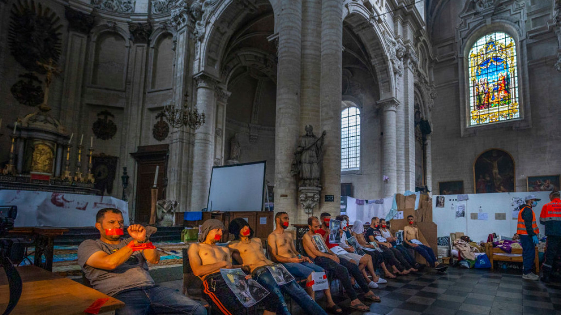 BRUSSELS, BELGIUM - JULY 13: Migrant workers stage a mass hunger strike for legal status inside the Church of St. John the Baptist at the Béguinage on July 13, 2021 in Brussels, Belgium. The undocumented migrants went on hunger strike 52 days ago and said they have lived and worked in Belgium for years. Secretary of State for Asylum and Migration Sammy Mahdi has been urged to grant them legal status. Doctors of the World, a humanitarian group, provide regular health care to those who went on hunger strike. 