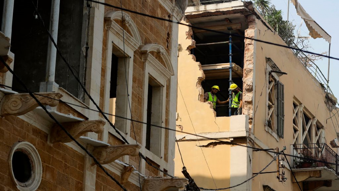Workers restore damaged building in Beirut