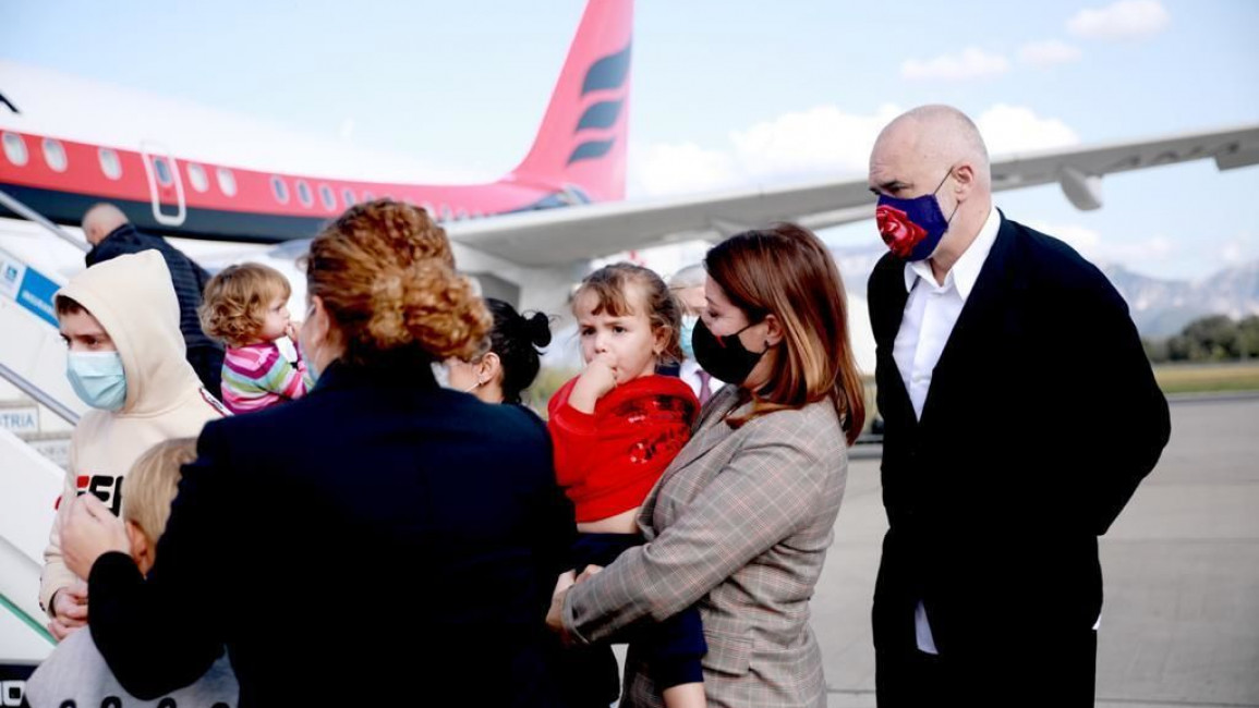 The women and children returned to Tirana international airport [Getty]