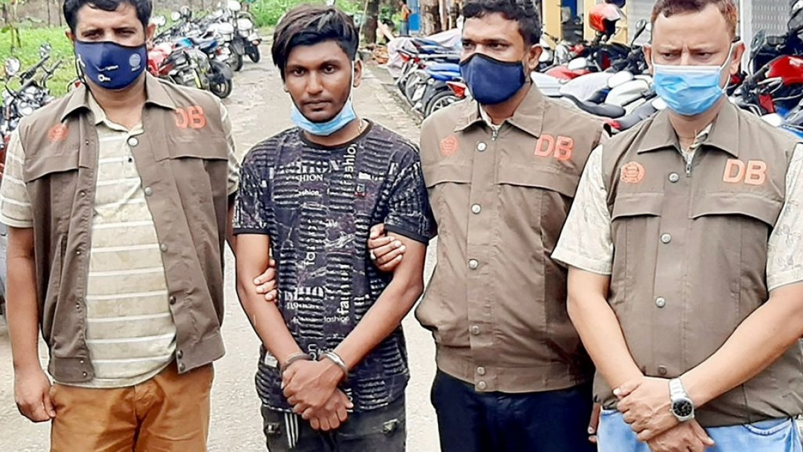 Yasin (second left) was detained by Bangladeshi police [Getty]