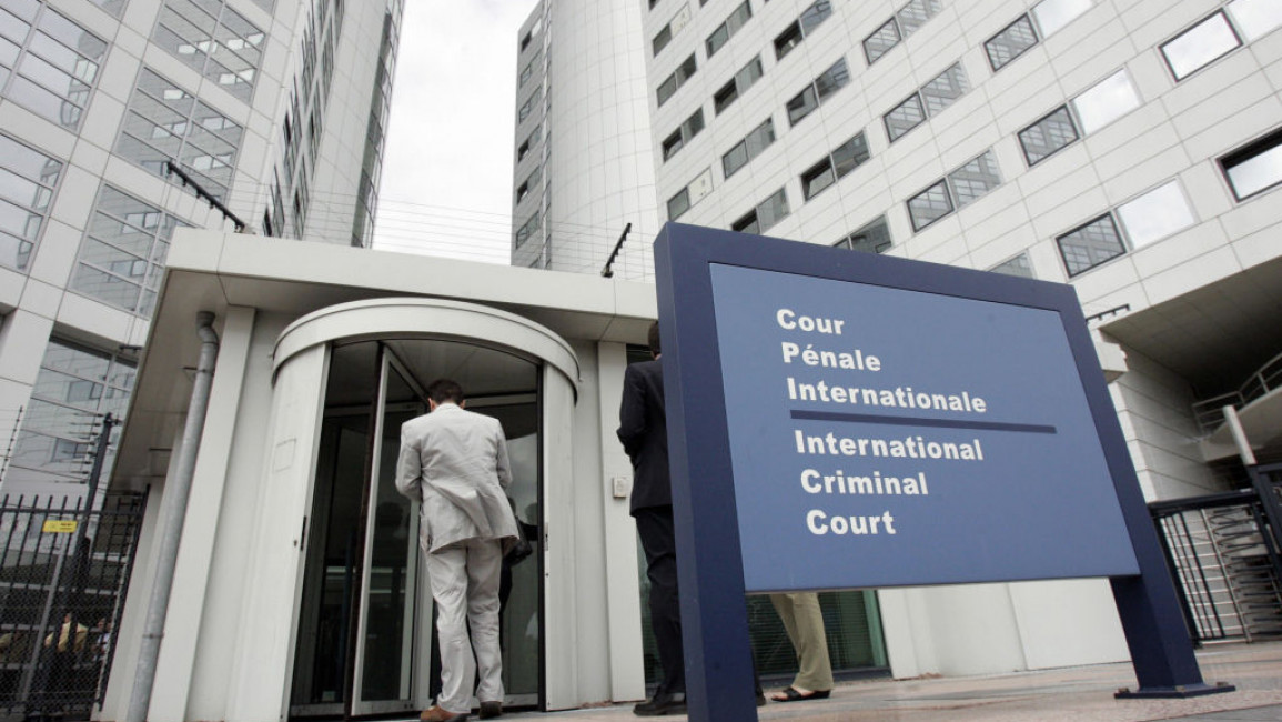 People enter the International Criminal Court, 20 June 2006 in the Hague. [Getty]
