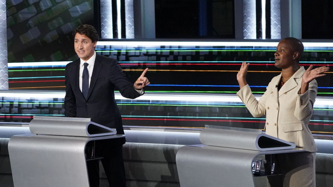 Canadian Prime Minister and Liberal leader Justin Trudeau (C) and Green leader Annamie Paul (R) [Getty]