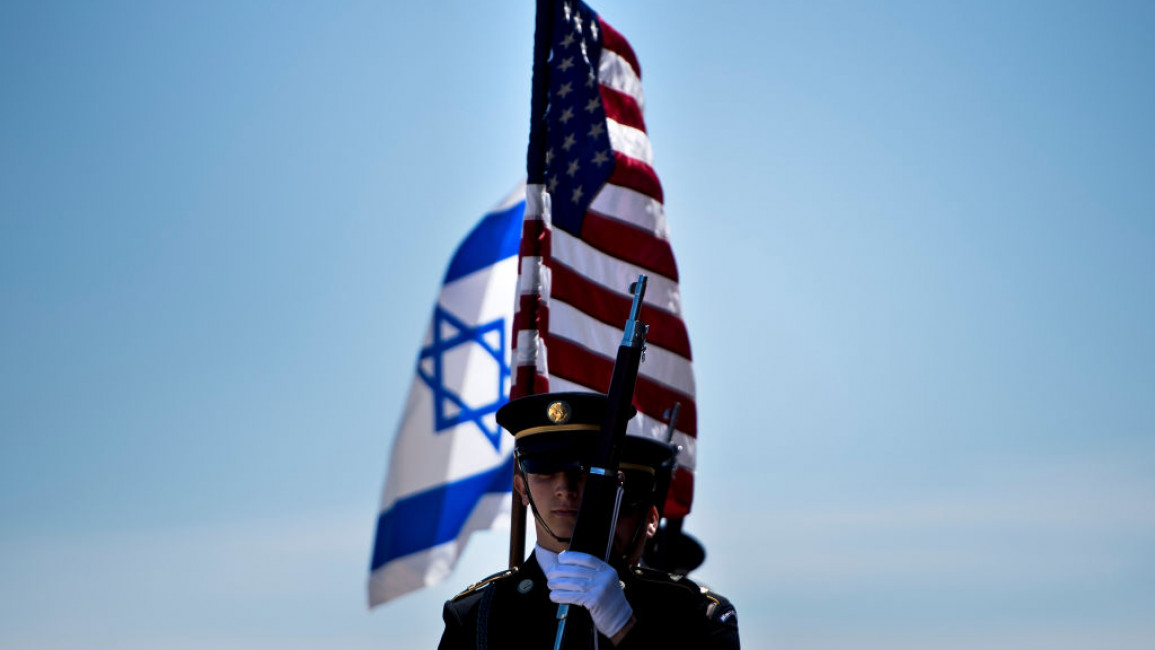 Members of the US military carry the flags of Israel and the United States before the arrival of Israel's Minister of Defense Avigdor Lieberman during an honor cordon at the Pentagon on 26 April 2018 in Washington, DC. [Getty]