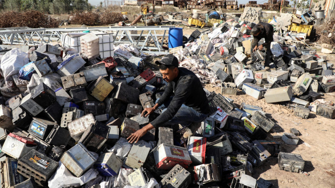 Palestinian workers sort through electronic waste such as batteries, a popular product in the midst of Gaza's electricity crisis. Whilst no formal means of recycling are available in Gaza, Palestinians have used their initiative in setting up local community schemes to help encourage recycling [Getty Images]
