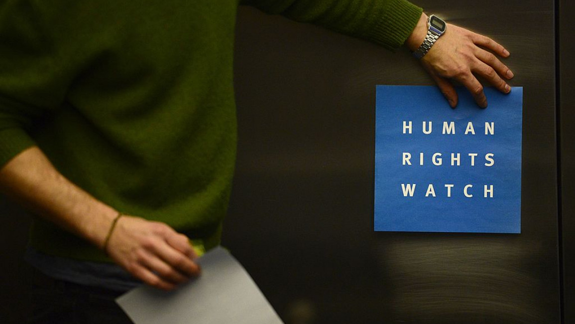 A Human Rights Watch logo on a door