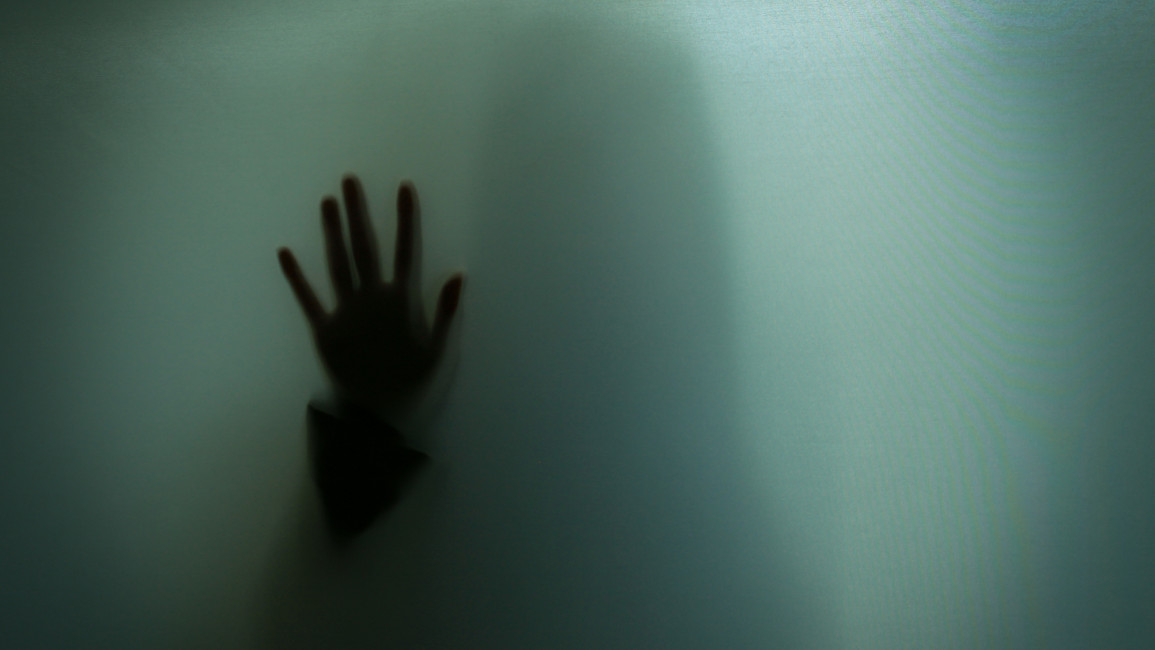 Hand Shadow Of Woman On Glass - stock photo