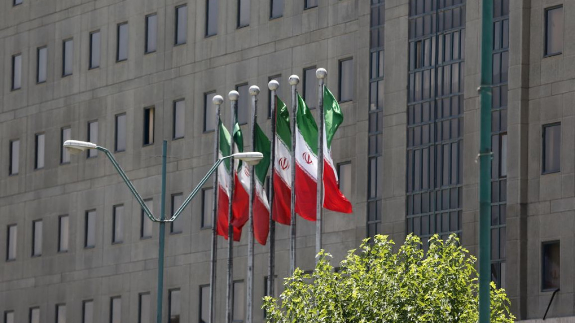 Six Iranian flags outside Tehran's parliament