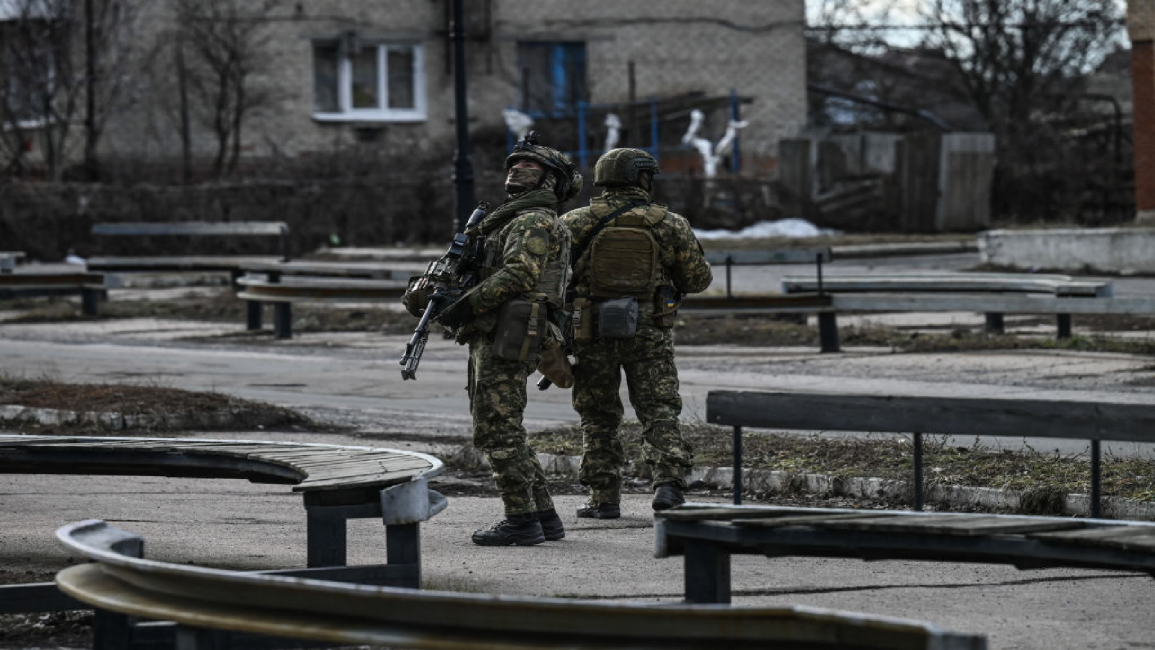 Ukrainian troops patrol in the town of Novoluhanske, eastern Ukraine