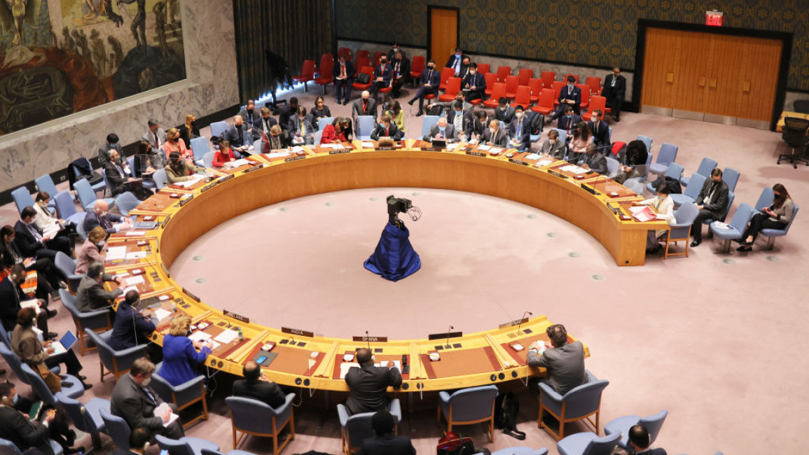 The UN Security Council sitting around a circular table