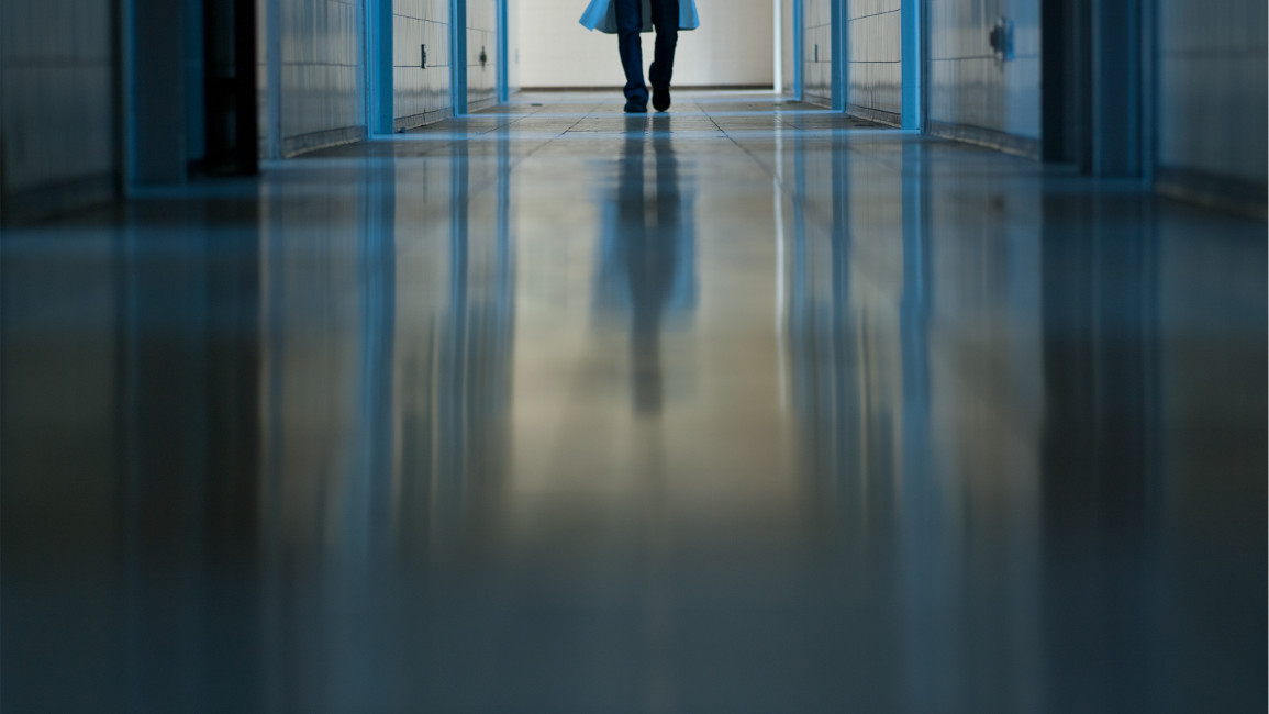 A doctor in a corridor in a hospital