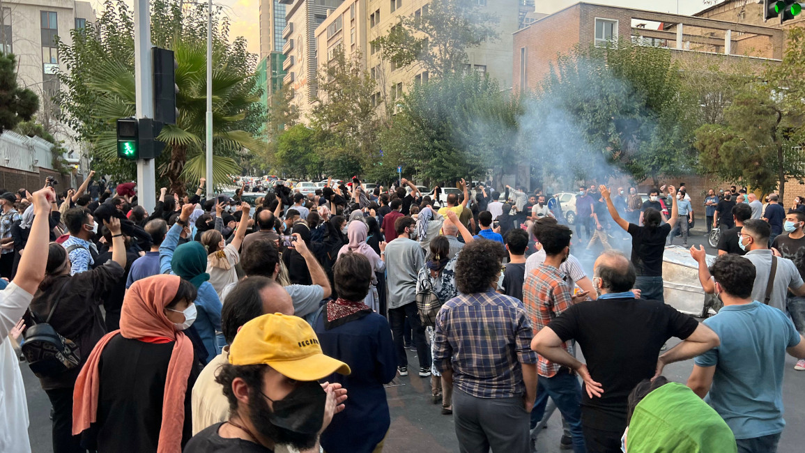 People gather during a protest for Mahsa Amini, a woman who died after being arrested by the Islamic republic's "morality police", in Tehran on September 19, 2022