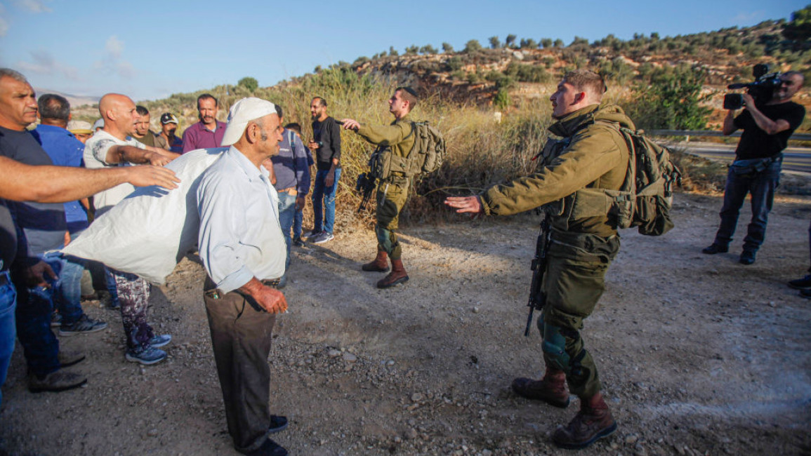 Israeli soldiers and settlers increased attacks as olive harvesting season began [Getty]