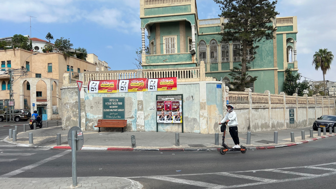 Jaffa's al-Ajami neighbourhood. Elections advertisement for Sami Abu Shehade's A-Tajamo party on a billboard. On top, a poster for the joint electoral list of al-Jabha, and the Arab movement for Renewal party.