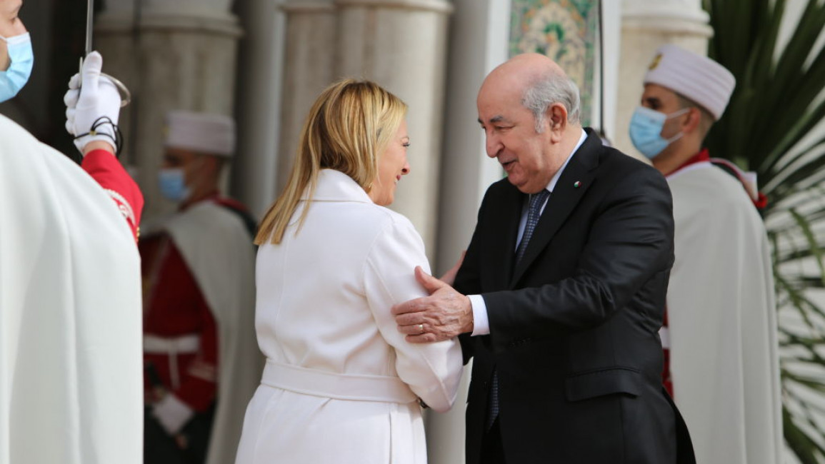 Italian Prime Minister Giorgia Meloni shakes hands with Algerian President Abdelmadjid Tebboune 