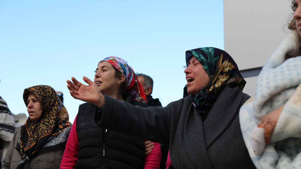 Raziye Toparli mourns the loss of her daughter and husband, killed after a building collapsed in Iskanderun, southern Turkey following a deadly earthquake on Monday morning. [William Christou/TNA] 