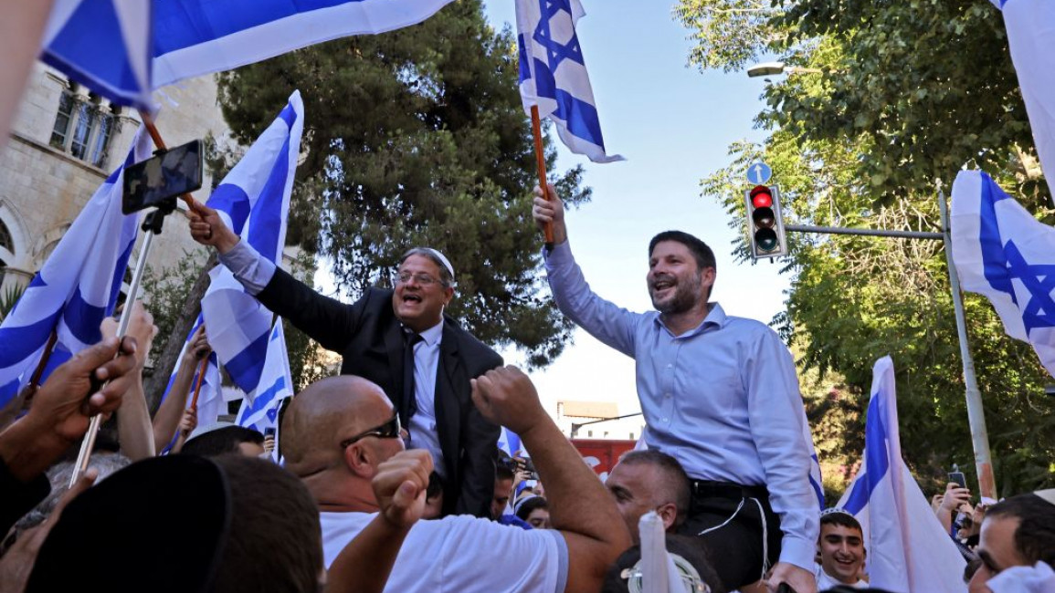 Israeli far-right lawmakers Bezalel Smotrich (R) and Itamar Ben-Gvir (L) take part in the ultranationalist Flag March outside Damascus Gate in Occupied East Jerusalem [Getty]