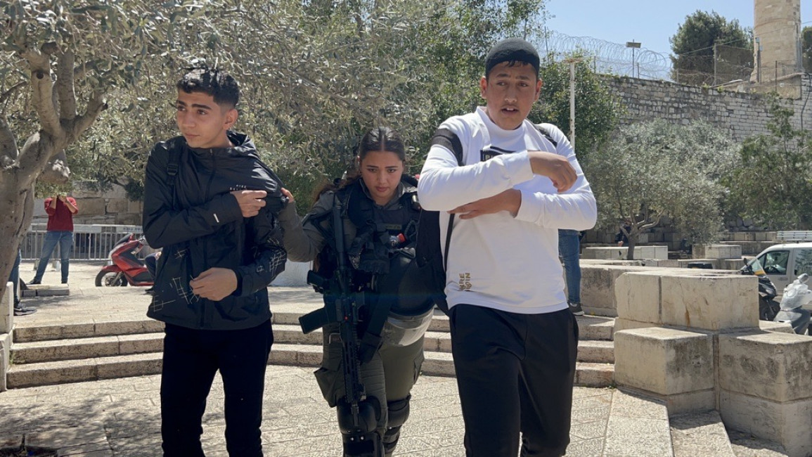 Israeli forces pushing Palestinian boys