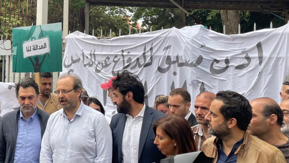 Nizar Saghieh (second from left) stands in front of the palace of justice before going standing before the Council of the Beirut Bar Association [TNA - William Christou]