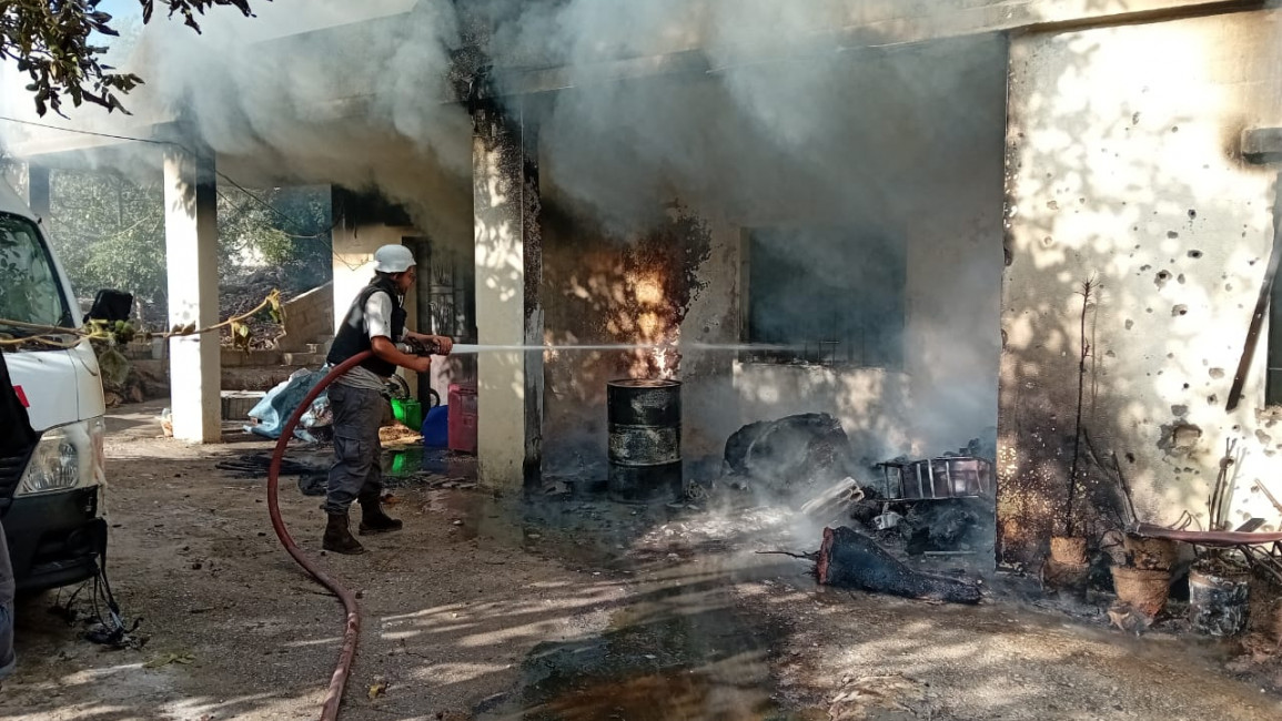 Fire fighters work to extinguish a blaze in the Dhayrah mayor's home, caused by Israeli strikes on Tuesday morning. [Shared by TNA with permission]