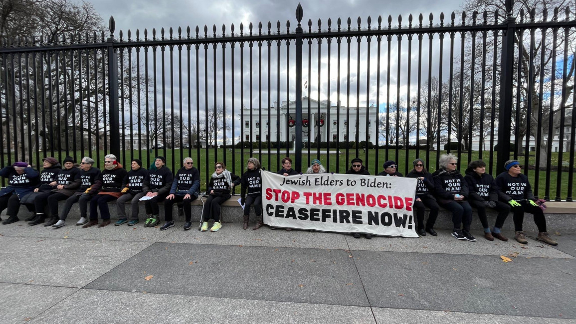 Jewish elders chain themselves to the White House gate in protest of Israel's war in Gaza. [Photo courtesy of Jewish Voice for Peace]