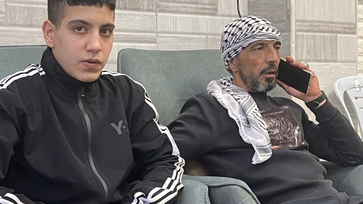 Ahmad Salaymeh next to his father, Nawaf, one day after his release from Israeli detention. The 8th grader was detained for throwing rocks and later accused of being anti-semite. Ibrahim Husseini/TNAi