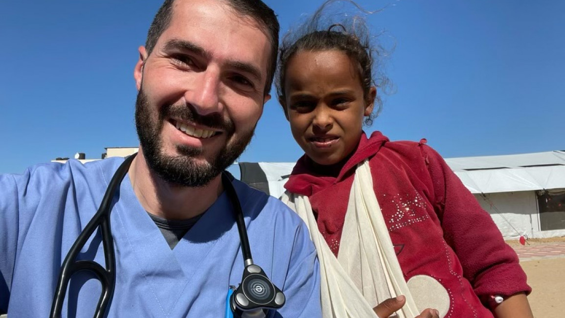 Dr. Mohammad Subeh poses with a young patient in Gaza. [Photo courtesy of Mohammad Subeh]