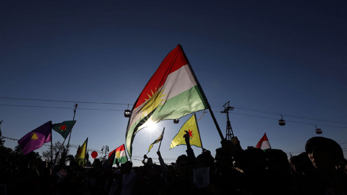Syrian Kurds wave the Kurdish flag in Erbil AFP