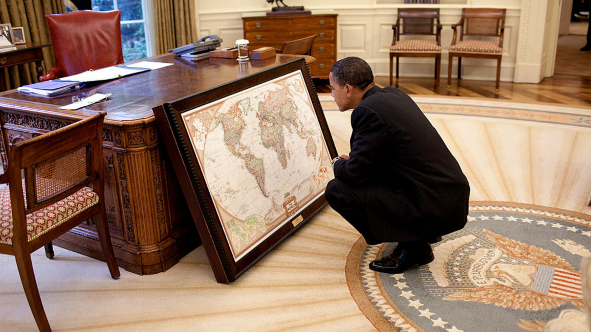 Obama looks at map