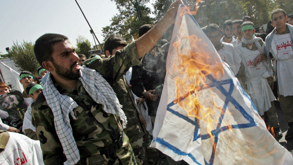 IRGC burning an Israeli flag [Getty]