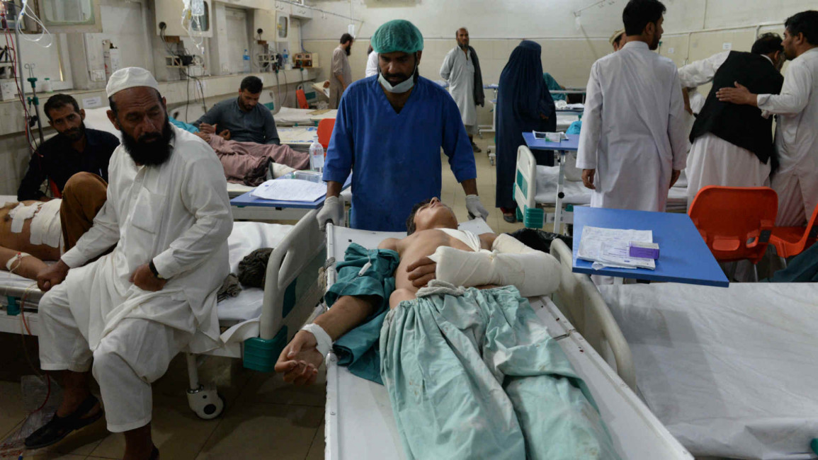 Afghans receive treatment after suicide blast in Jalalabad
