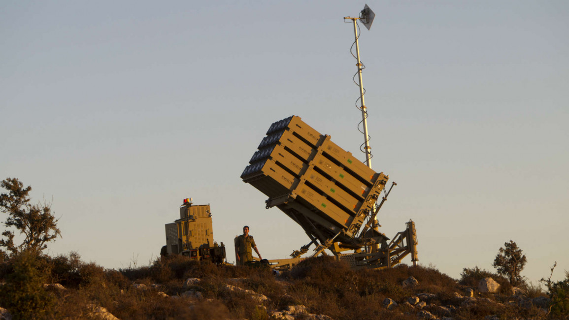 Israeli soldiers by an Iron Dome Gottere