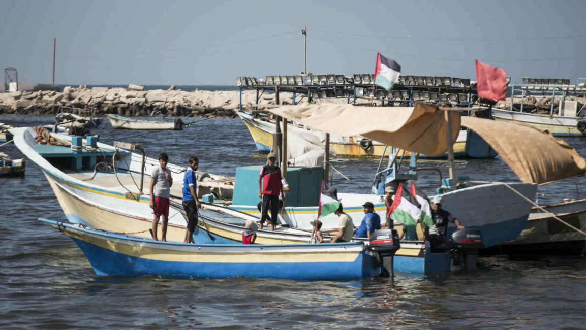 Palestinian fishermen seen on their boats