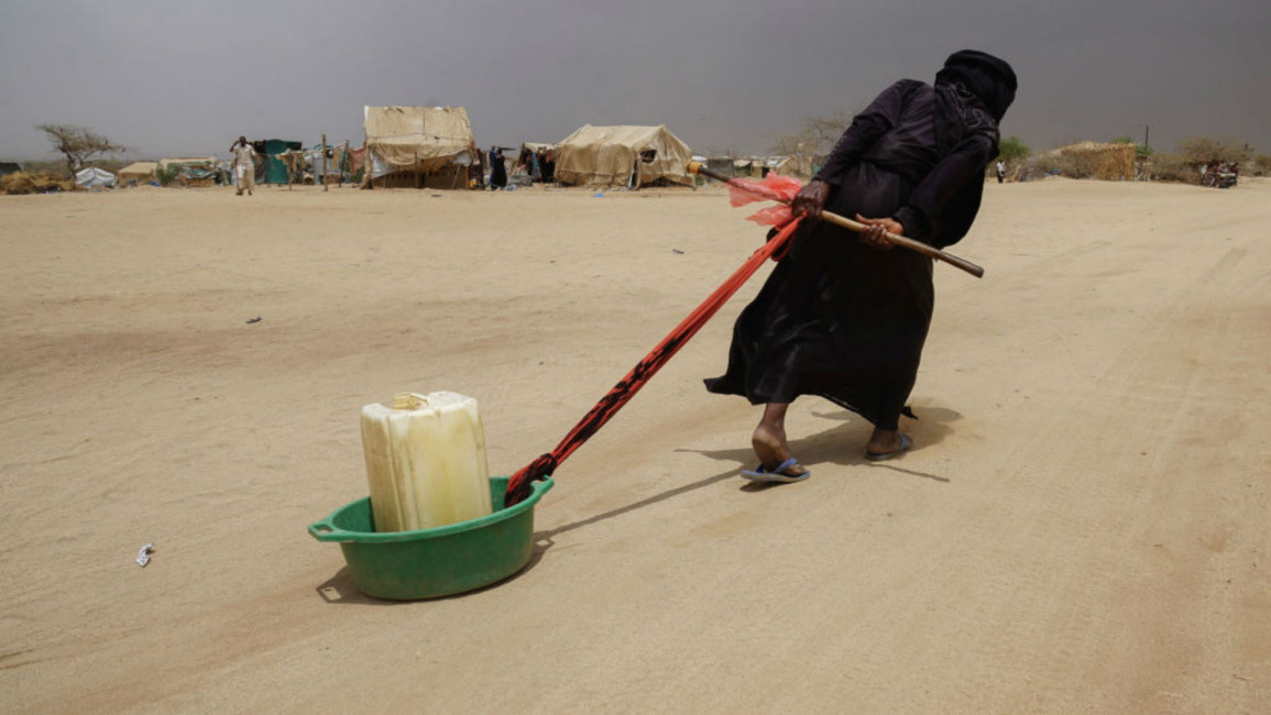 Yemen woman  water - Getty 