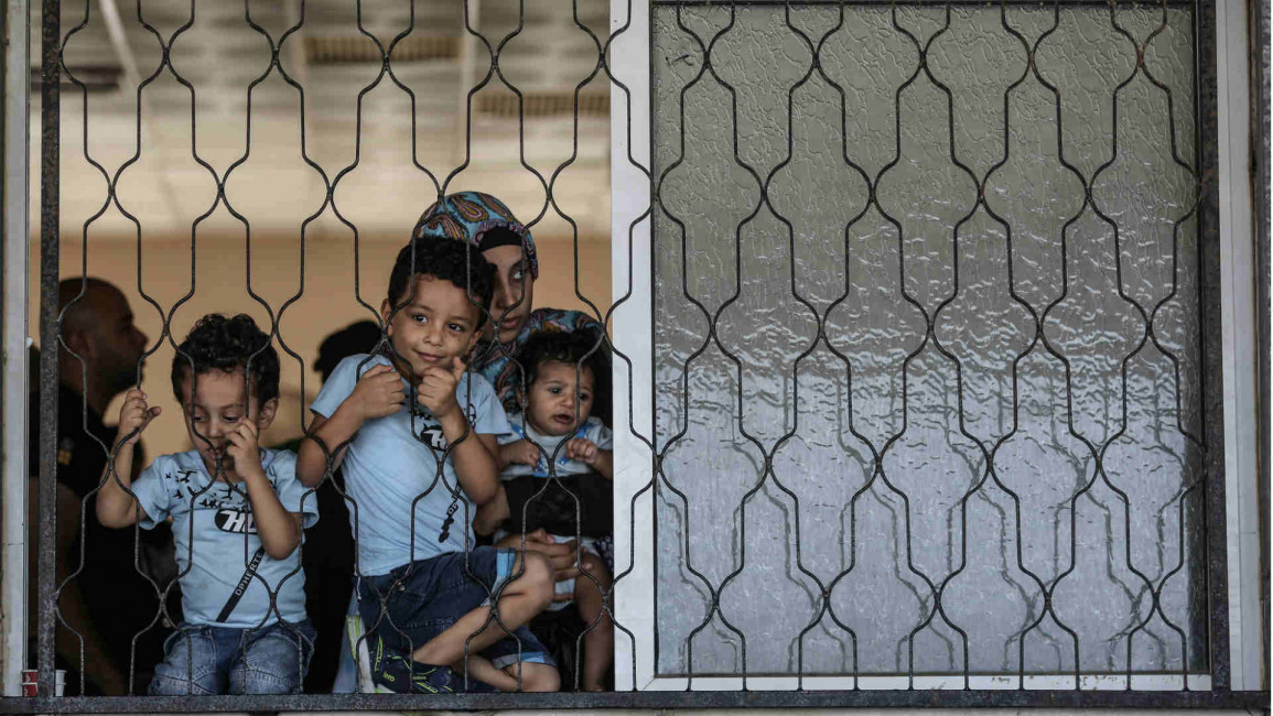 Palestinians at passport control at Gaza border