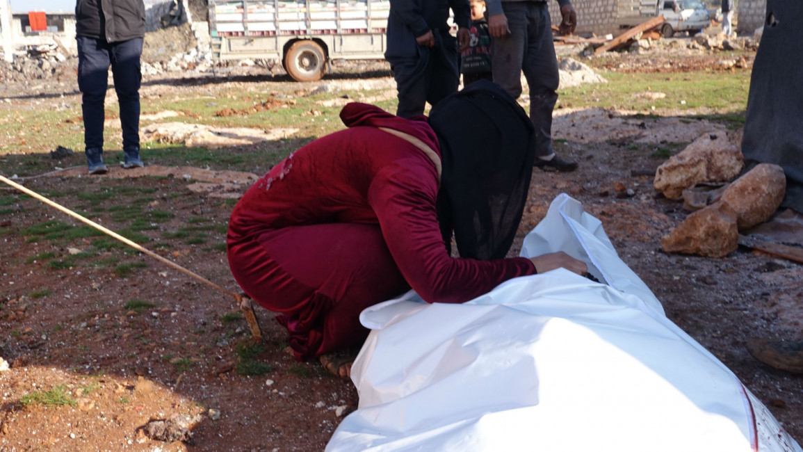 Women mourning over dead body Idlib [Getty]
