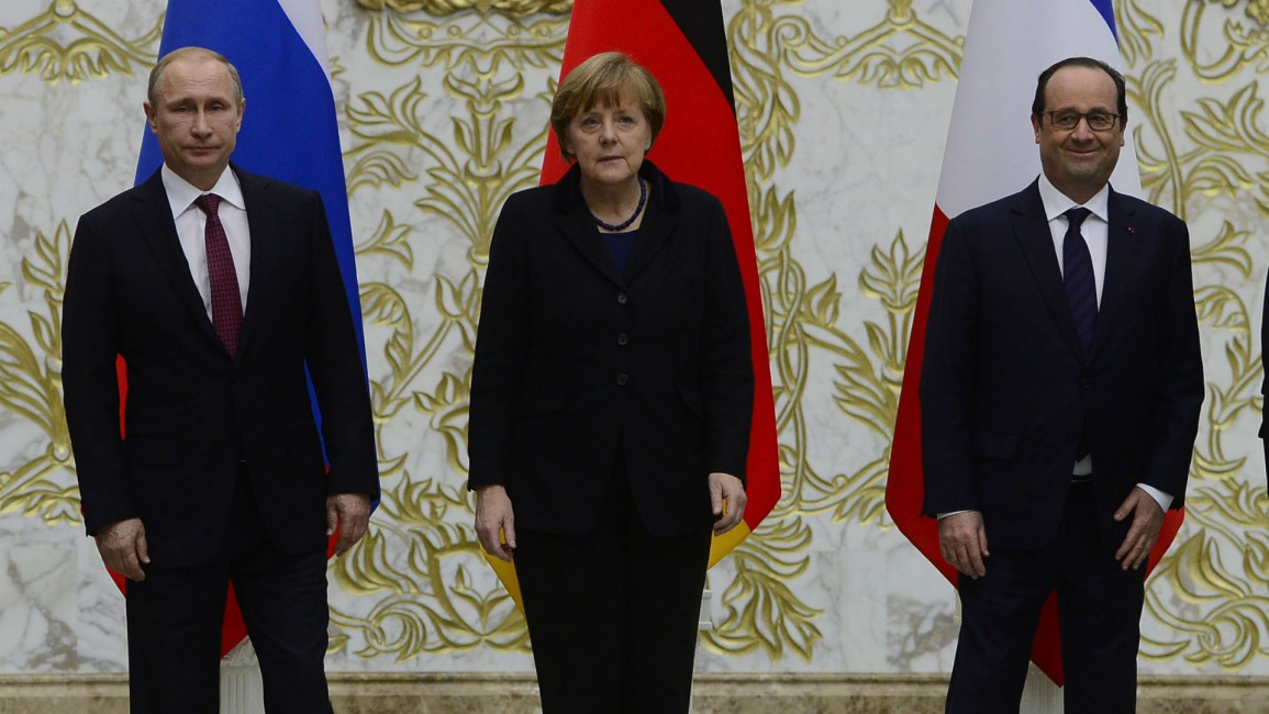 Putin, Merkel and Hollande ANADOLU
